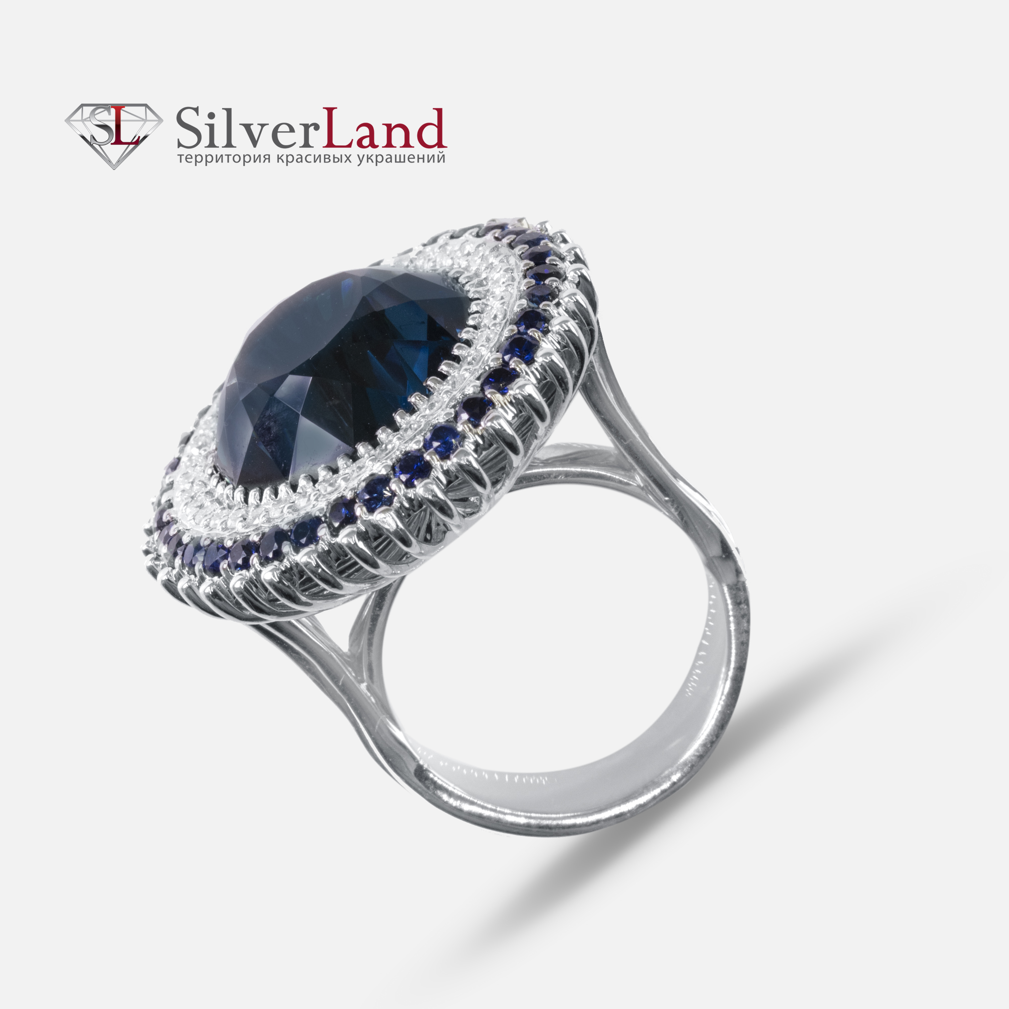 Изображение кольца из белого золота с топазами сапфирами и бриллиантами в ювелирном онлайн магазине Сильверленд